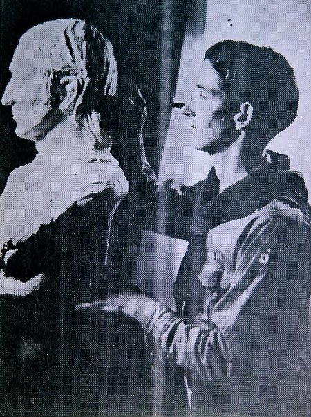 Man making sculptor of Andrew Lester. 