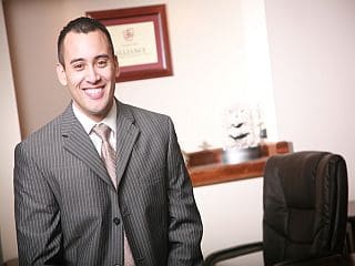 Jeff Rose wearing suit in office.