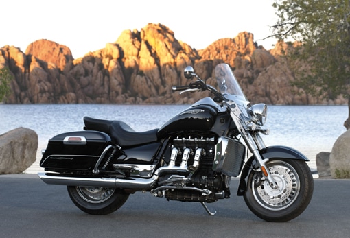 triumph rocket touring bike motorcycle next to lake