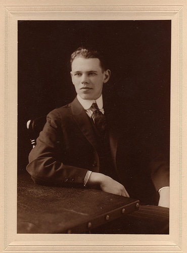 Young man sitting on chair portrait.