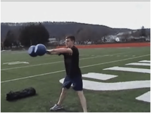 Man doing exercise of kettlebell in the ground. 