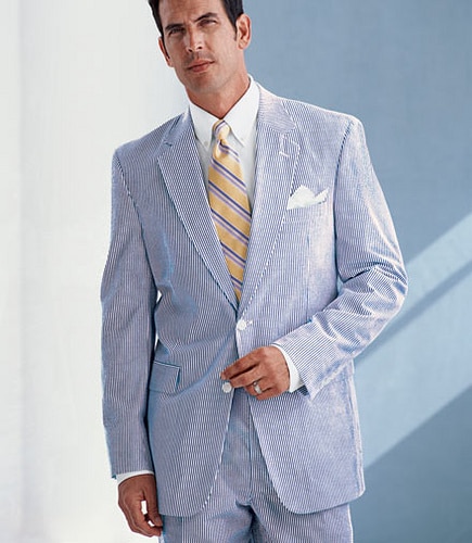 Man wearing Seersucker suit with tie summer dress outfit.