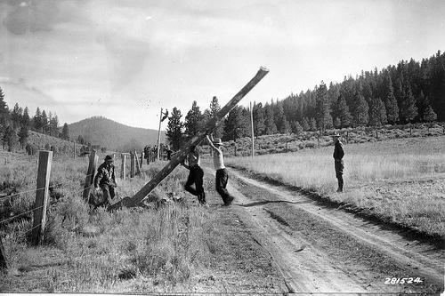 Civilian conservation corps oregon vintage men working and placing concrete block.