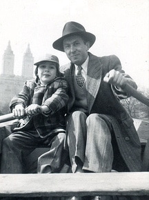 Vintage father and son in a rowboat.