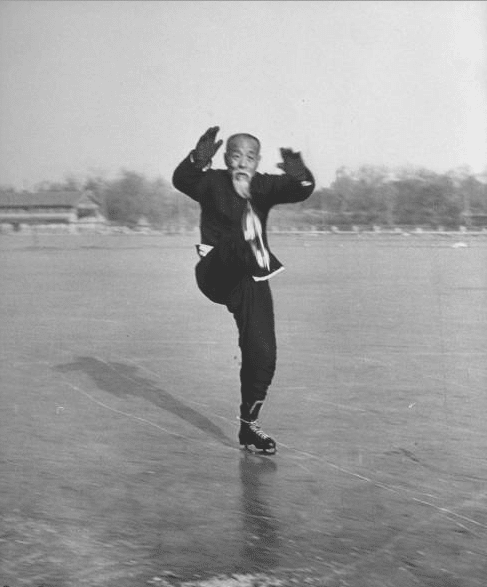 Vintage asian old man doing kung fu while ice skating.