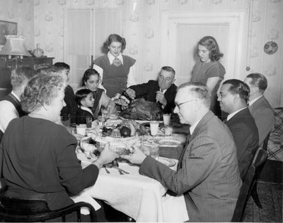 Vintage family having dinner at the table.