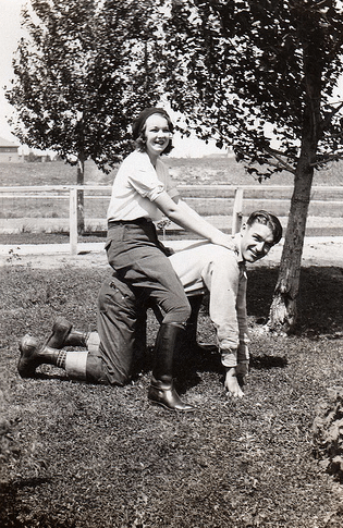 Vintage couple playing in yard.