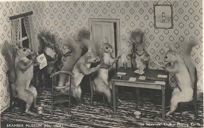 Vintage squirrels playing poker game in doll house.