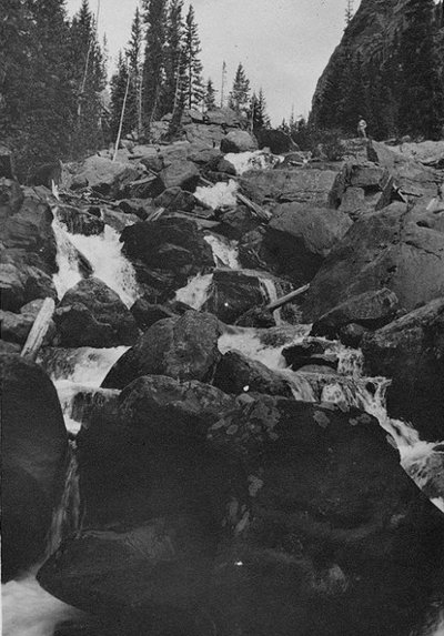 Vintage mountain waterfall in the rocks.