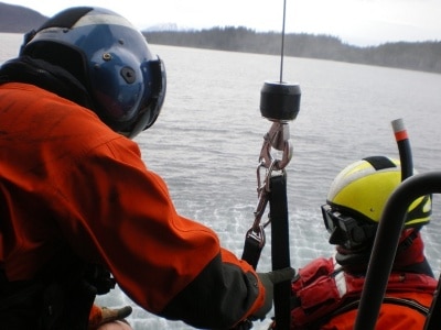 Adam Sustachek coast guard on a rescue mission.