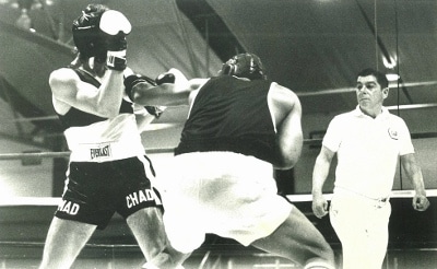 Boxers having a bout in ring.