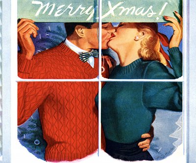 Couple kissing while holding Merry Xmas's board.