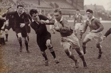 Players running in rugby match. 