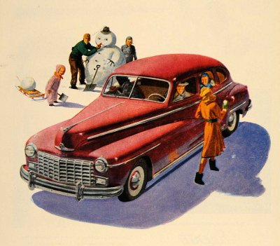 People making snowman while a person is talking to a woman in a red car. 