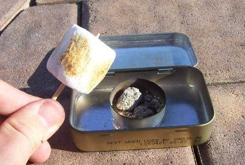 Altoids tin using for marshmallow roasting kit.