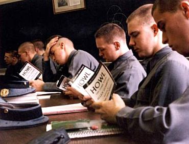 Military cadets reading howl poem in hall. 