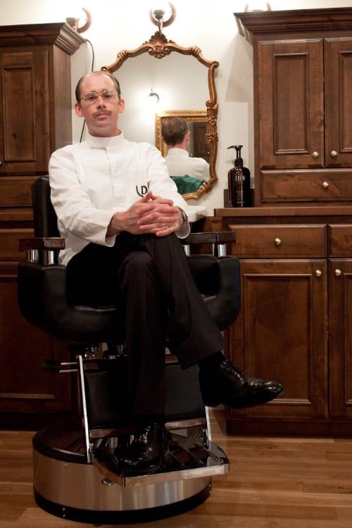 Man sitting in danburry barber shop.