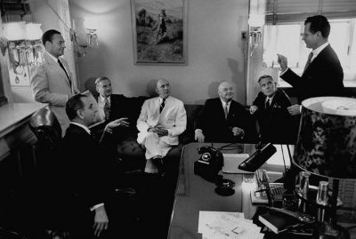 Vintage men giving presentation in a meeting room. 