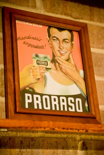 Vintage ad man holding proraso brand.