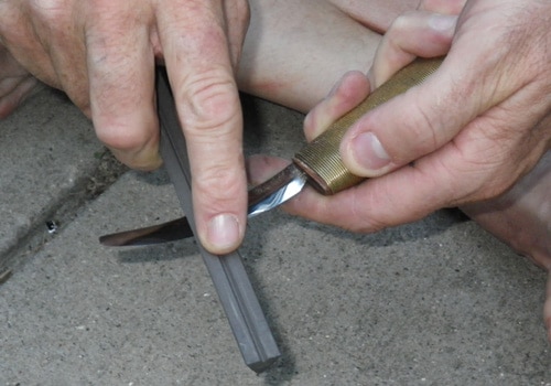 A man sharping the knife.