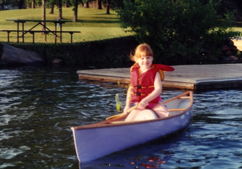 A baby girl in the boat.