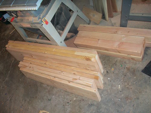100_3028 piles of cut measured lumber homemade dining table