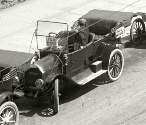 Vintage cars with parallel parking in street. 