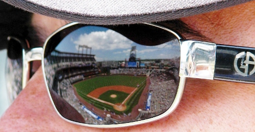 sunglasses coors field rockies stadium reflected in man's sunglasses