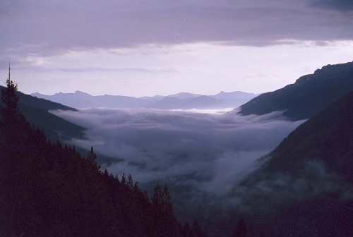 Mountain valley covered with clouds. 