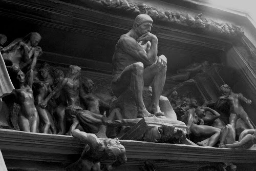 Vintage Dante sculpture of thinker famous statue. 