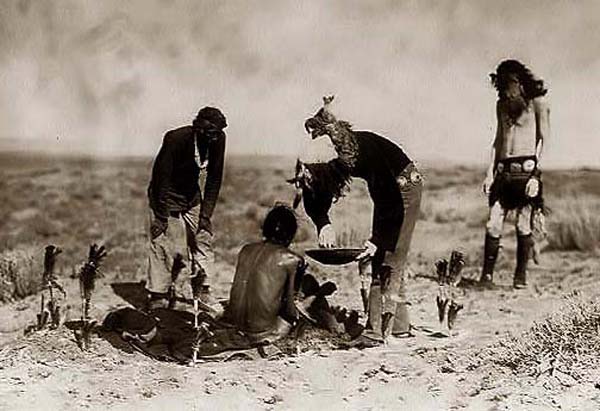 Vintage men organizing magic ceremony in field. 