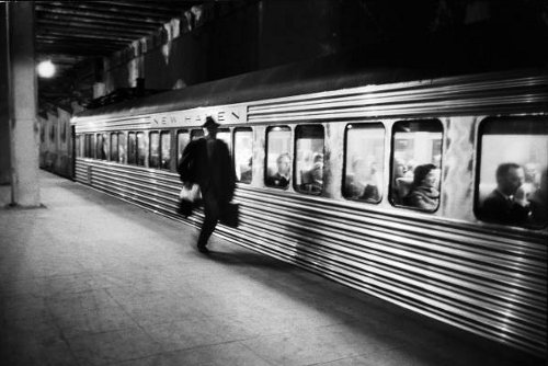 Vintage man running to catch subway train. 