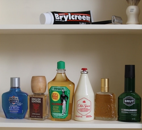 Vintage aftershave medicines and shaving cream in a cabinet.