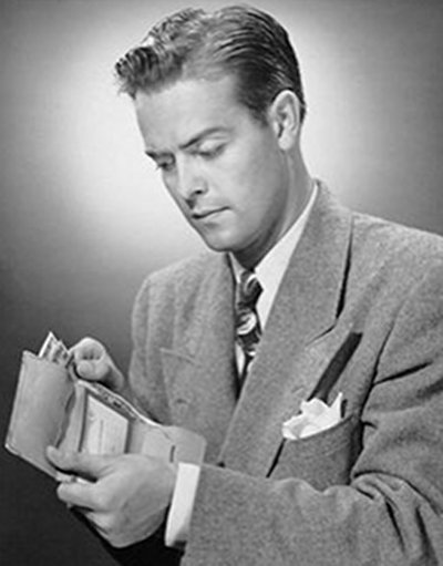 Vintage businessman in suit holding wallet and pulling the cash out.