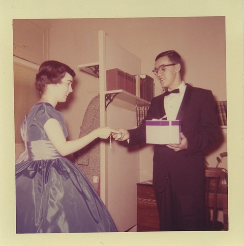 Young man giving gift to girl. 