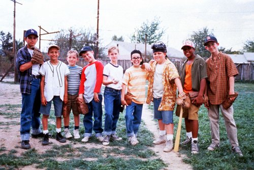 Cast of sandlot movie taking a picture after playing basketball.