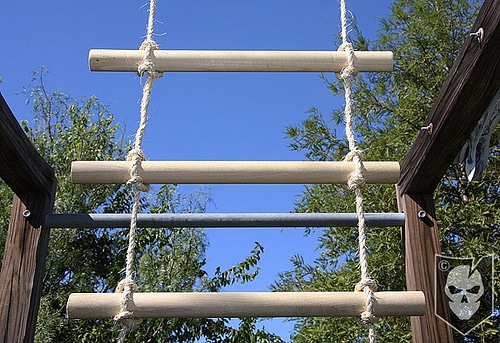 Rope ladder with wooden rungs. 