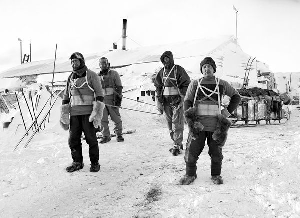Scott antarctic men hauling sleds in snow. 