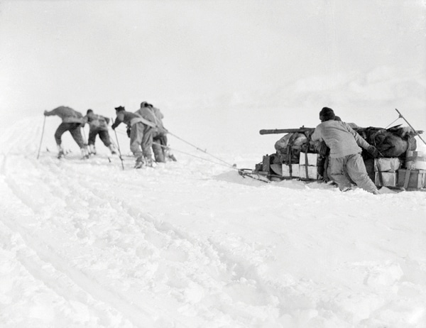 Scott antarctic men hauling sled sledge in snow. 