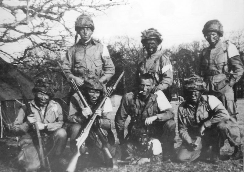 Vintage group of soldiers covered with mud in battle. 