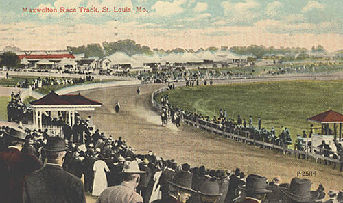 Crowd enjoying horse racing competition in stadium.