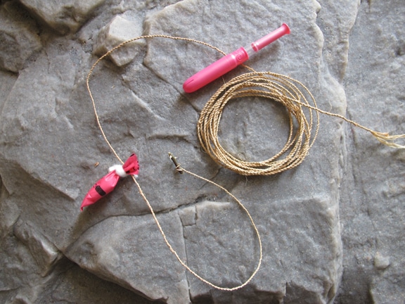 Vintage fishing bobber placed at stone.