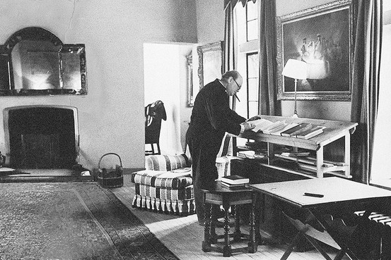 Vintage man working at an upright desk illustration.
