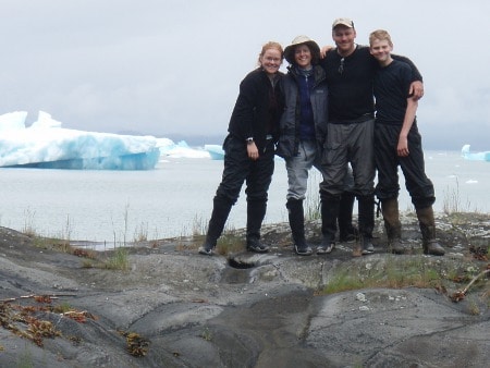 Family portrait standing on rock.