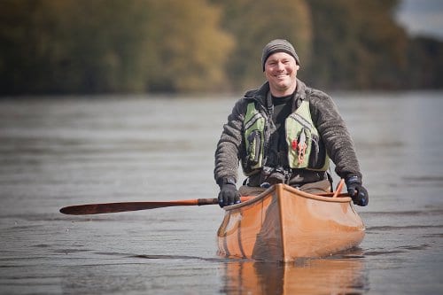 Darren Bush canoeing in the lake.