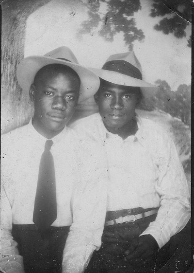 Vintage two young boys wearing hats close up black and white photo illustration.