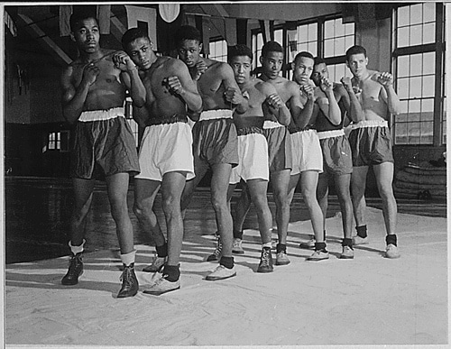 Vintage group of amateur boxers posing in shorts.