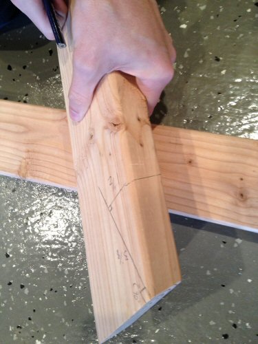 Cutting wood board with miter saw.