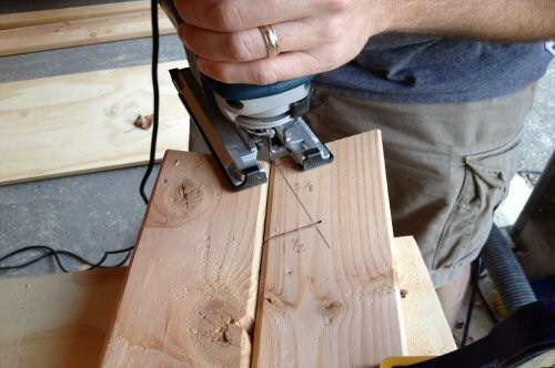 DIY homemade wooden sawhorse cutting with jigsaw.