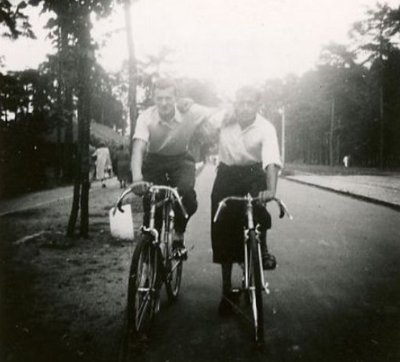 Vintage two young men cycling on the road black and white illustration.